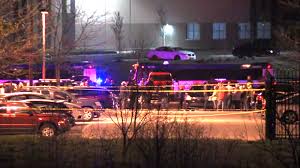 An active crime scene in which numerous police vehicles are shown and the area has been taped off. 
Photo courtesy of ABC News