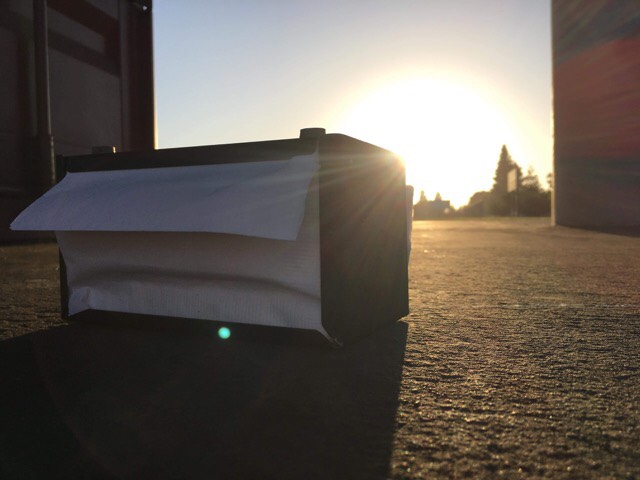 A lone napkin dispenser from the cafeteria lays between the two outer soccer fields at Fremont. 